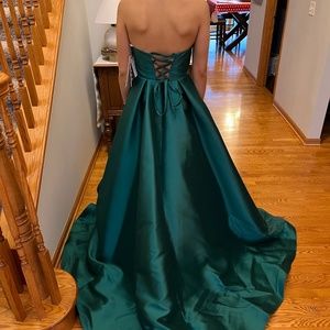New with tags, never worn stunning emerald green strapless prom dress.